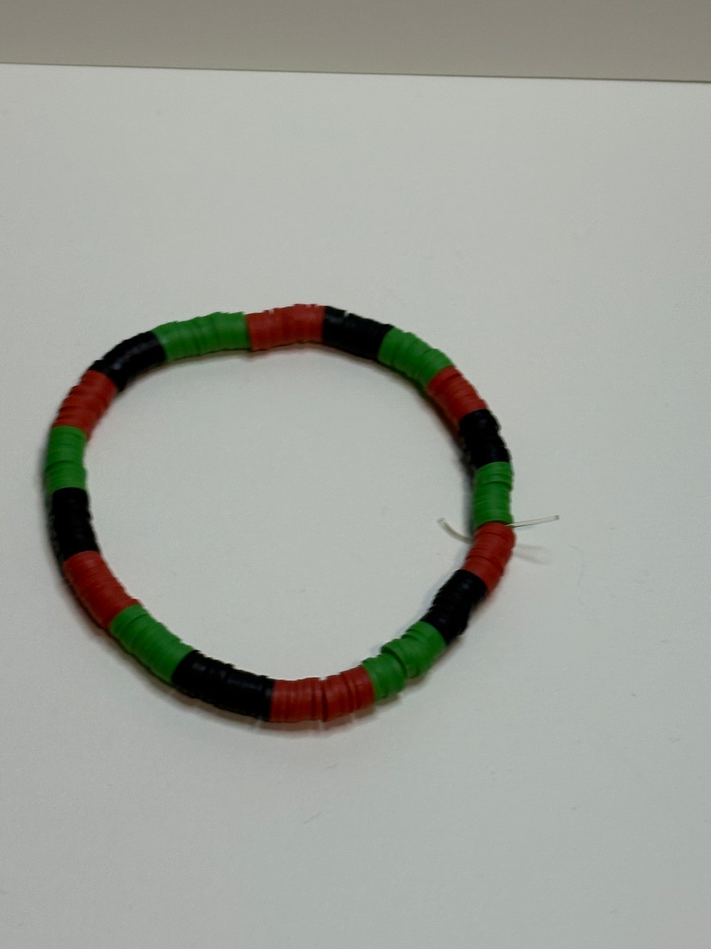black, green and black bracelet